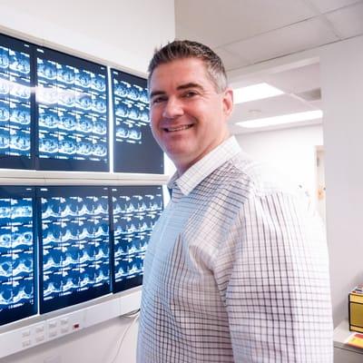 Dr. Cunningham checking out a patient's MRI.