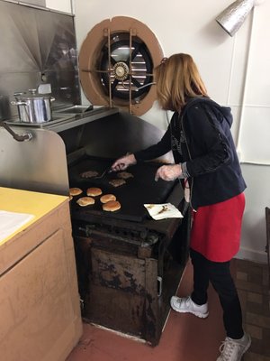 Michele's working the grill for hungry folks.