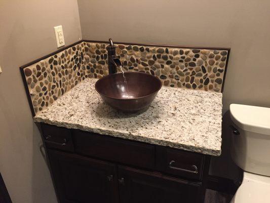 Granite Counter Chiseled Edge with Pebble Backsplash