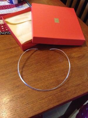 The Collet collar necklace. All their items come packaged in a coral box and soft fabric bag.