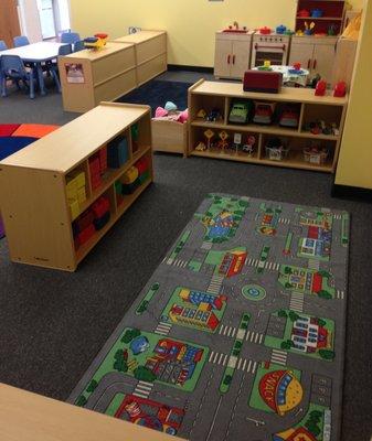 Play with blocks and trucks in our toddler rooms