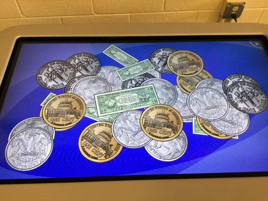 Learning about money on the digital SMART table