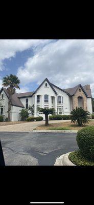 Exterior makeover .  New stucco , roof and paint