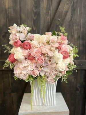 Light pink tall vase arrangement