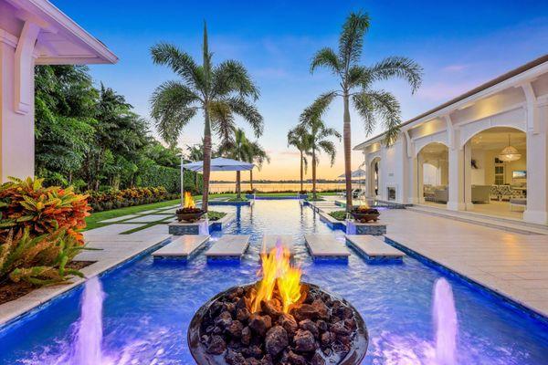 Live life in paradise at a gorgeous home in Miromar Lakes