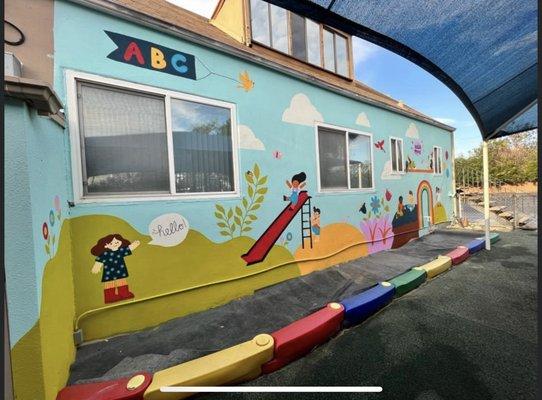 Our students love our playground! Thank you to one of our parents, Emily Van Dyke, for painting such a beautiful mural!