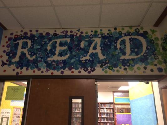 The back of the library. The"READ" was made by flowers that were fold by students from the art class.