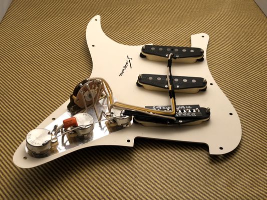 Tidy wiring on a Signature Strat set loaded pickguard by Stonewall Pickups.