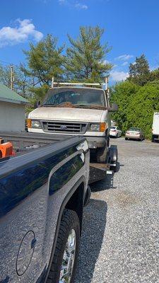 Econoline Van being picked up for scrap