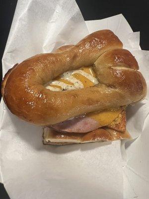 Hot ham and cheese on a pretzel bun with some sort of magic sauce.