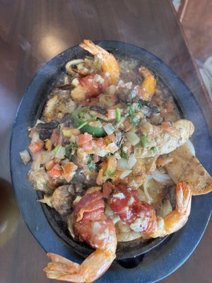 Grilled shrimp with beef and chicken fajitas.