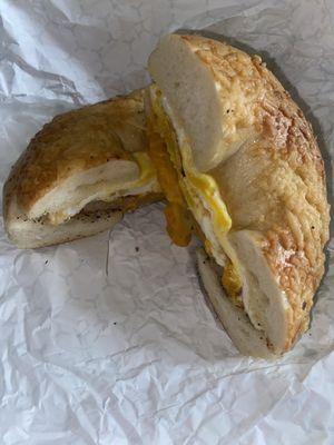 Sausage egg cheddar Asiago Bagel