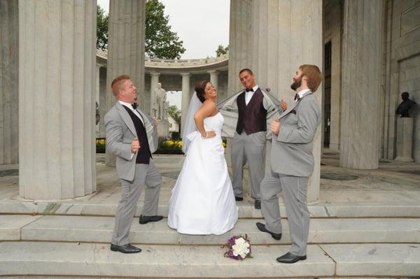 Bride enjoys attention from the groomsmen at the McKinley Memorial.