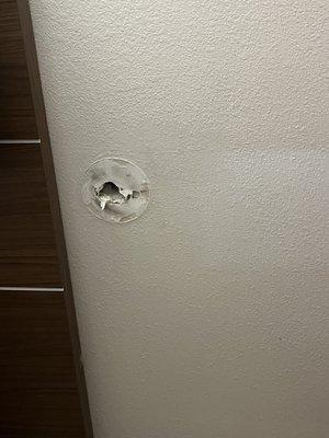 Hole behind door