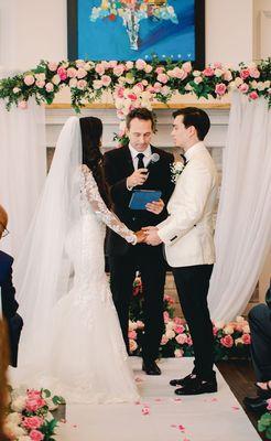 The Rowans exchanging nuptials with officiant at Savannah Country Club