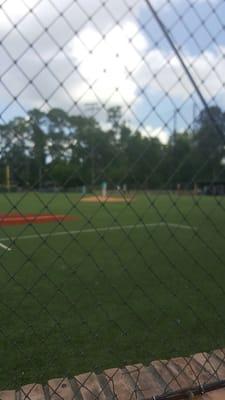 My little cousin playing baseball