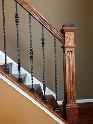 Blending dark oak wood with oil rubbed bronze balusters