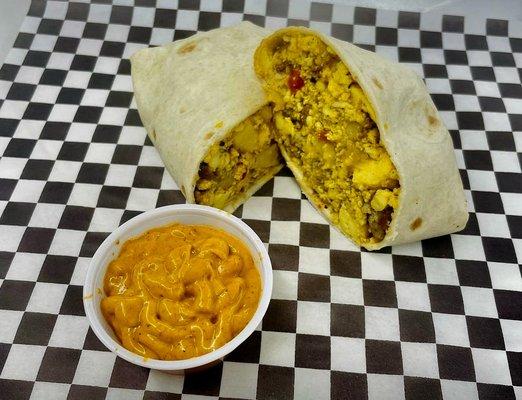 Chorizo and sausage, breakfast burrito with a side of chipotle