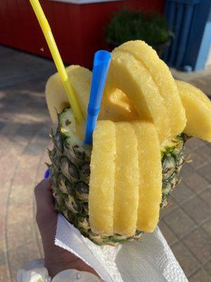 Pineapple/Mango Smoothie (non alcoholic) in a pineapple with pineapple chunks