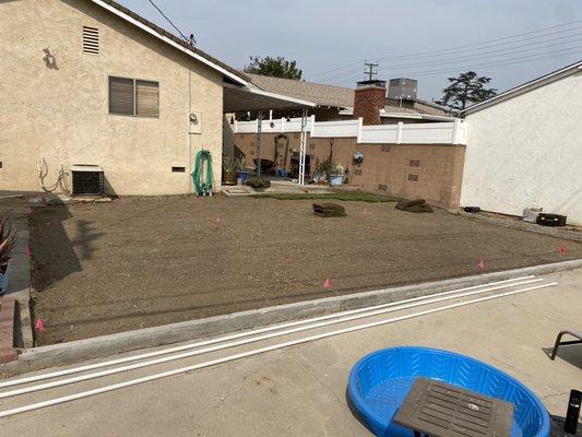 Leveled area and installation of irrigation system and Sod.