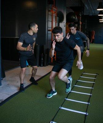 Professional Athletes Hyder Amil and Camilo Mejia working on agility and footwork with Joshua Berkovic Training