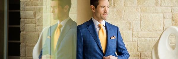 High blue plaid Canali sport coat, yellow/blue stripe Eton dress shirt, yellow Brioni tie, and light tan Zanella trouser.