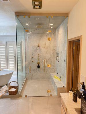 frameless shower enclosure, satin brass