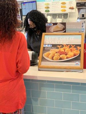 Cashier wearing BLACK LIVES MATTER mask.