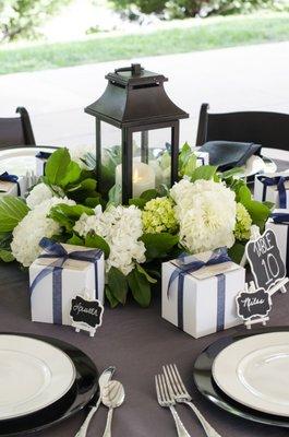 Classic lantern surrounded by hydrangea for a simple but elegant rehearsal dinner.