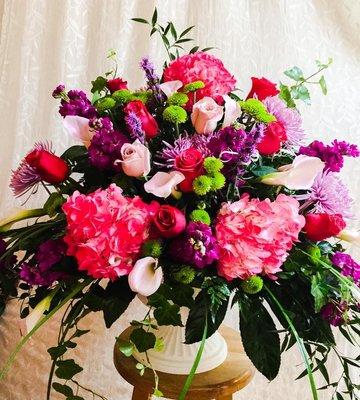 Lovely arrangement with assorted roses, hydrangeas, and other flowers.