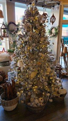 Beautiful white flocked Christmas tree. Would be perfect at home.