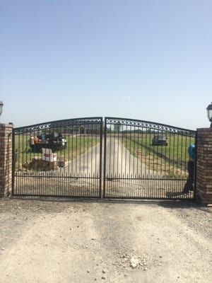 8ft Iron automatic swing gate with puppy bars.