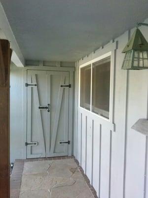 Siding, window, and utility closet.