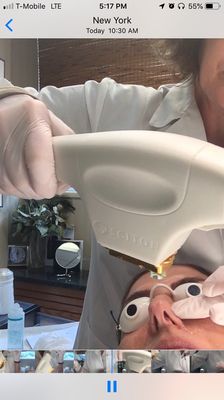 Laura Tsudome, clinical aesthetician performing IPL