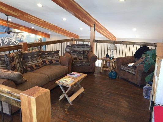 Upstairs area with couches and chairs