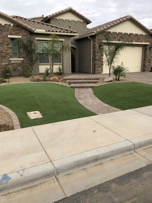 new front yard with pavers, lighting, Artificial turf, rock and plants