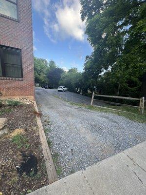 Gravel driveway. Have to pull luggage up .