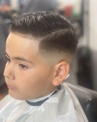 Here we have a middle bald fade comb over style . One of the more popular style and cuts