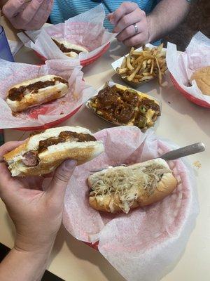 Chili cheese dogs with onions, kraut dog, loaded fries with jalapeños, plain fries and a cheeseburger