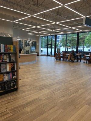 Welcoming, bright, open space with community tables throughout the store. This is B&N's new concept--like