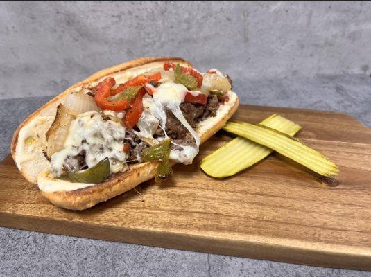 Milo's Special - Shaved Angus Ribeye, caramelized onions, sauteed bell peppers & mushrooms, American & provolone cheese on a sub roll