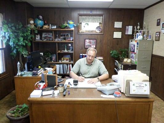 Agent Dennis Miller doing paperwork 2015.