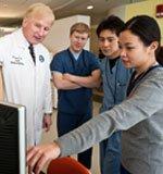 Dr. Griffin with graduate students Will Akin, Teppei Tsukiyama and Ju-Ying Lin. (Photo credit: Alonso Nichols, Tufts University)