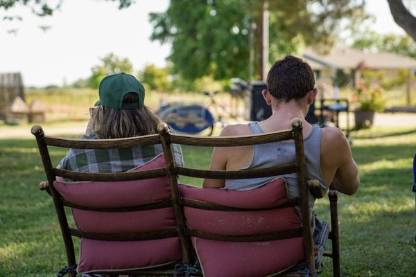 Friends sitting together enjoying the country view