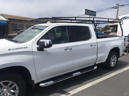 Work truck with new lumber rack and work box installed.