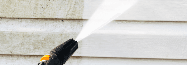 Cleaning vinyl siding.