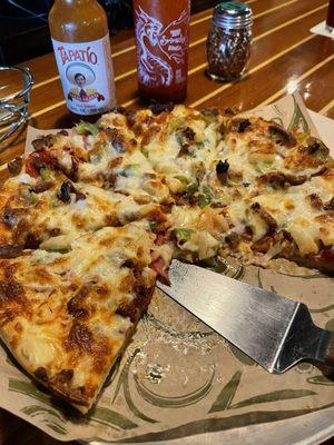 Combination pizza. I subbed pineapple and sun dried tomatoes for the mushrooms and black olives. Spiced it up with some hot sauce.