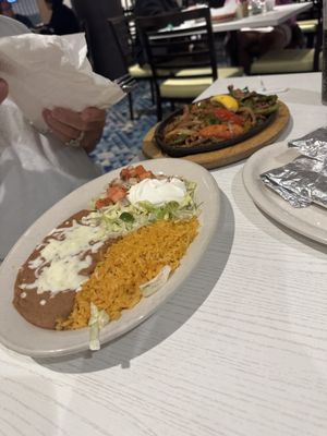 Refried beans, rice & fajita toppings.