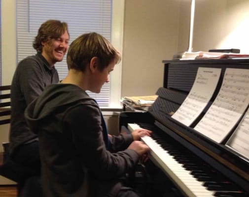 Mr. John and Student at piano