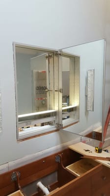 Vanity cabinet with built in motion LED light, outlet and USB port.